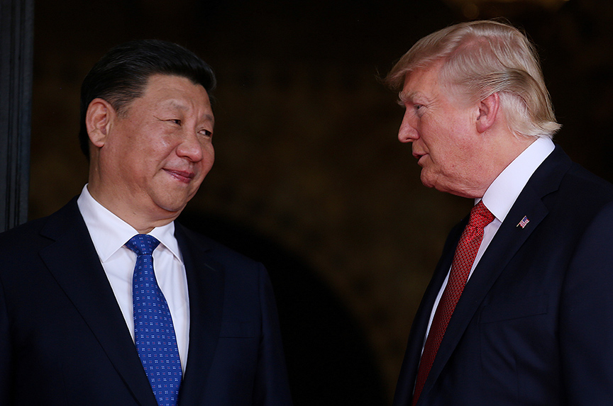 FILE PHOTO: U.S. President Donald Trump welcomes Chinese President Xi Jinping at Mar-a-Lago state in Palm Beach, Florida, U.S.